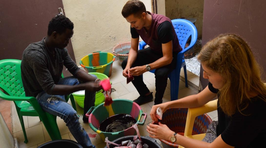 A Projects Abroad group prepares juices for talibés for their volunteer work with children in Senegal. A group prepares juices for talibés while they volunteer with children in Senegal.